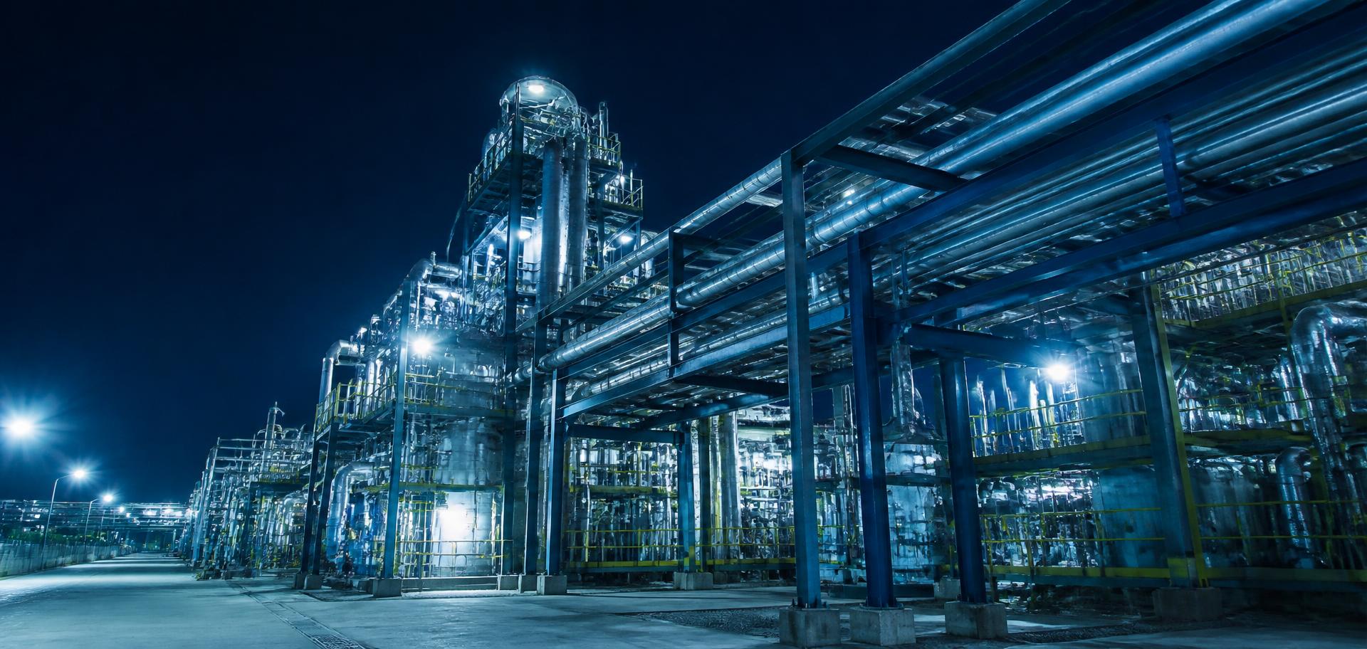 Industrial gas processing plant illuminated at night